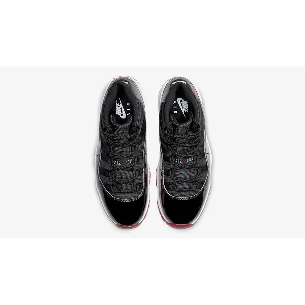 Air Jordan 11 Bred – Iconic Black and Red Leather Design