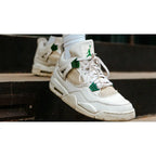 Air Jordan 4 Retro Metallic Green – Classic Silhouette with Bold Green Accents