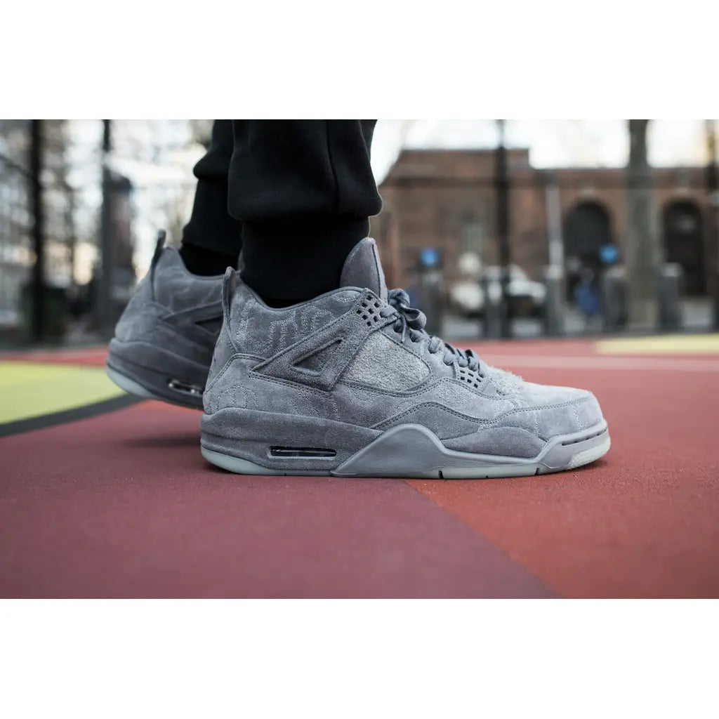 KAWS x Nike Air Jordan 4 – Premium Suede Collaboration with Iconic Design