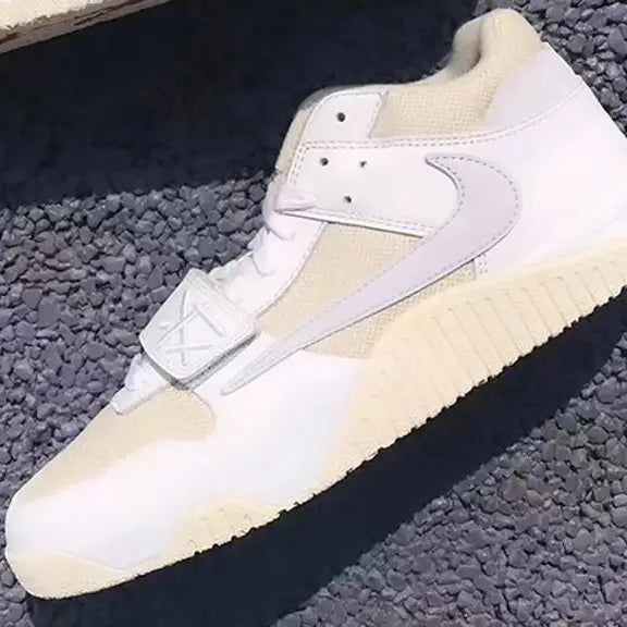 White and beige sneakers on a textured surface